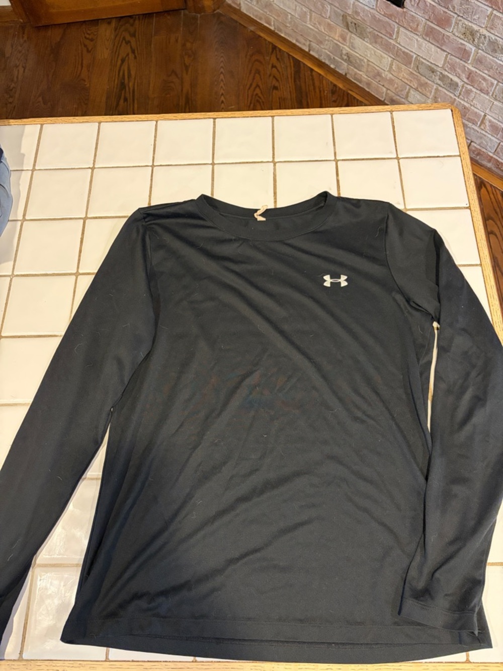 Under Armour women’s  Black Long Sleeve Performance Shirt
